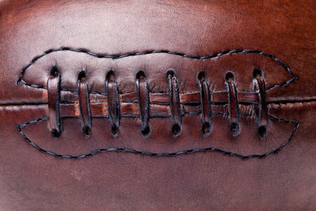 classic old leather football backgroundの写真素材