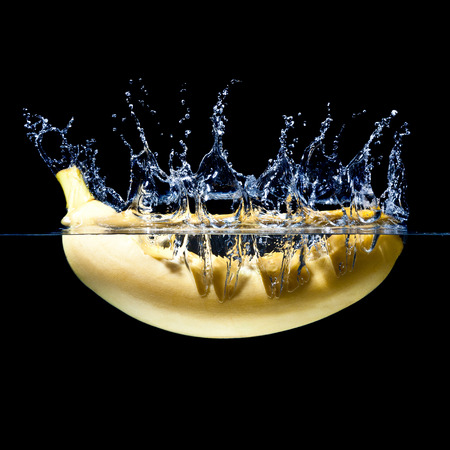 high speed photography banana splash in waterの写真素材