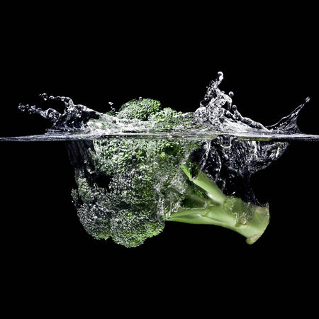 high speed photography broccoli splash in waterの写真素材