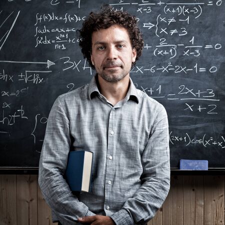 portrait of caucasian teacher and blackboard backgroundの写真素材