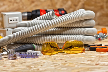electrician tools on osb wood background