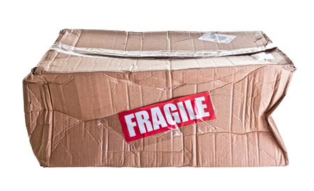 damaged cardboard parcel on white background