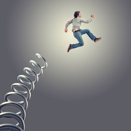 jumping man and huge metal springerの写真素材