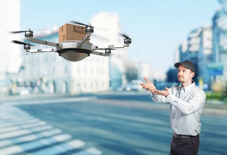 delivery man and 3d droneの写真素材