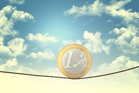 euro coin balance on ropeの写真素材