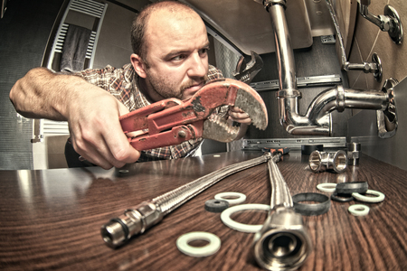 plumber at work indoor shotの写真素材