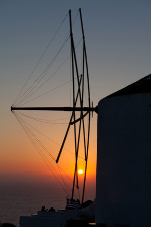 oia mill at sunset santorini island greeceの写真素材