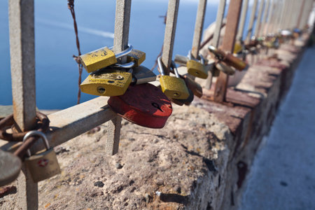 Oia,Santorini, GREECE - June 14, 2015:padlocks with love message left on the fence of the castle of Oiaのeditorial素材