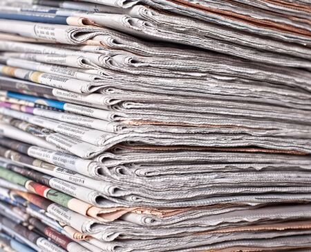 stack of daily newspapers backgroundの写真素材