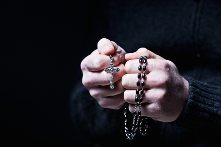 closeup image of hands and rosaryの写真素材