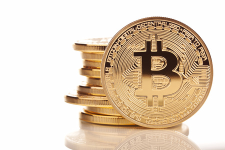 gold  bitcoin on white backgroundの写真素材