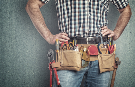 handyman portrait detail of toolsbeltの写真素材