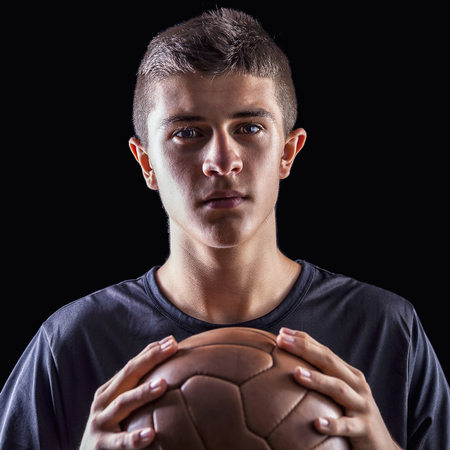 portrait of soccer player on black backgroundの写真素材
