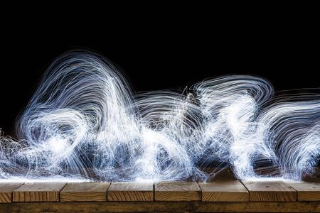 abstract lights on old wood dark backgroundの写真素材