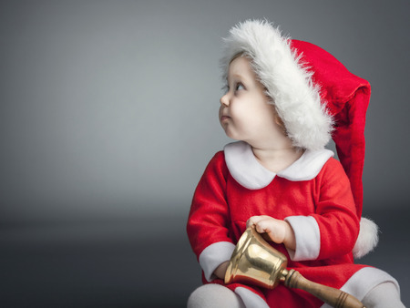 portrait of cute female caucasian child with santa claus clothesの写真素材