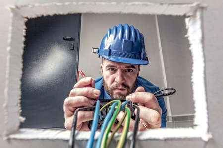 portrait of caucasian electrician at workの写真素材