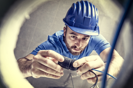 portrait of caucasian electrician at workの写真素材