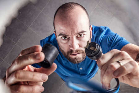 portrait of caucasian electrician at work