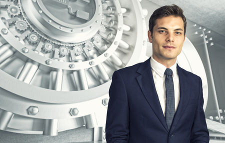 businessman portrait and 3d image of huge vault doorの写真素材