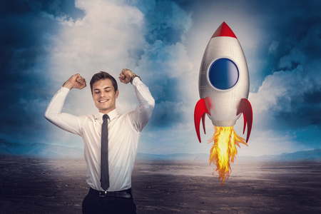 happy businessman and toy concept rocketの写真素材