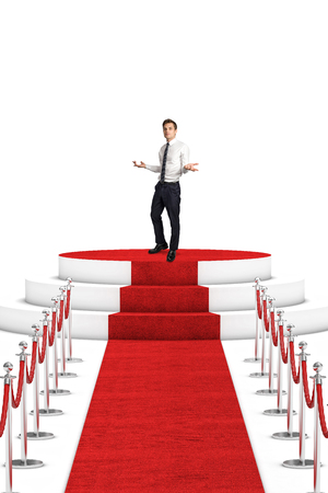 man on podium and red carpet with rope barrierの写真素材