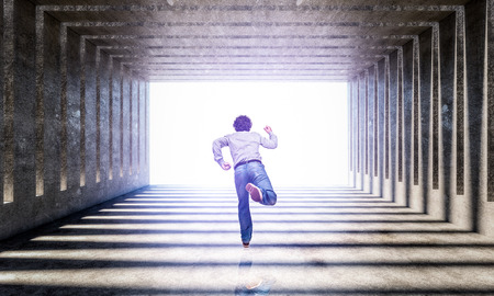 man run in concrete modern architecture background 3d rendering imageの写真素材
