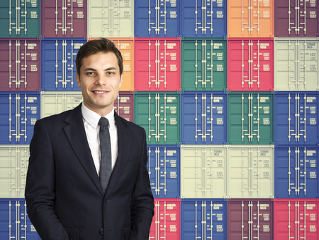 smiling businessman and colorful cargo container