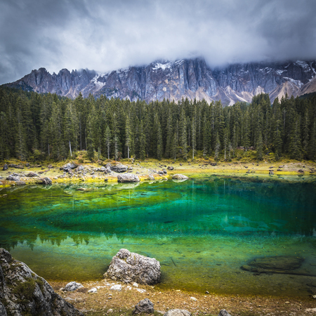 Famous Carezza lake on Italian alps
