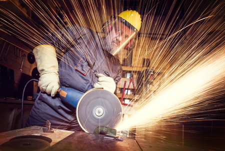 portrait of craftsman work with grinderの写真素材