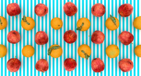 flat lay background of a series of oranges and apples on a blue and white striped background, 3d...