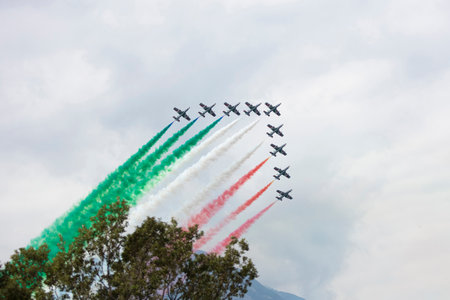 Varenna, Italy - SEPTEMBER 29, 2019:The aerobatic "tricolor arrows" team of the Italian military aeronautics performs above Lake Lecco during an airshow event.のeditorial素材