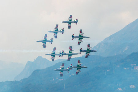 Varenna, Italy - SEPTEMBER 29, 2019:The aerobatic "tricolor arrows" team of the Italian military aeronautics performs above Lake Lecco during an airshow event.のeditorial素材