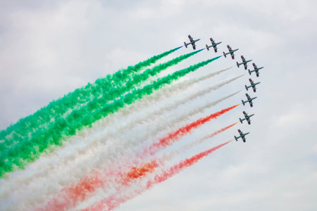 Varenna, Italy - SEPTEMBER 29, 2019:The aerobatic "tricolor arrows" team of the Italian military aeronautics performs above Lake Lecco during an airshow event.のeditorial素材