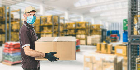 worker with mask in a warehouse full of goods