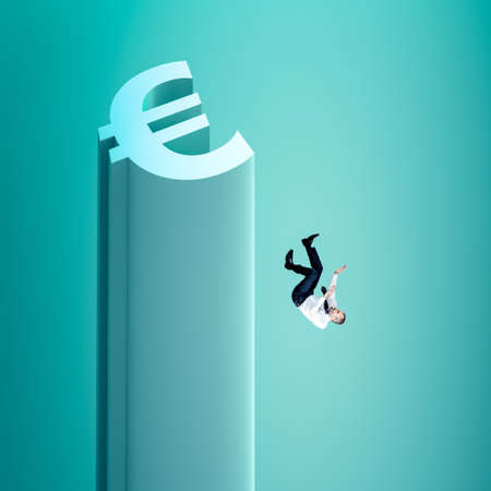 man falls from a euro-shaped tower. financial crisis concept.の写真素材