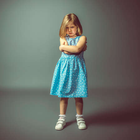 photographic portrait of an angry caucasian little girl. studio shotの写真素材