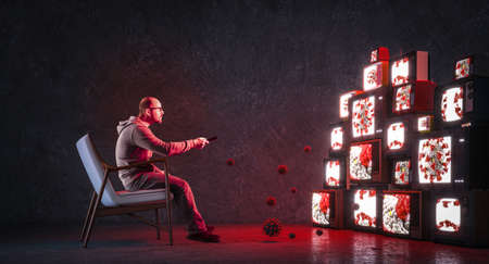 man on an armchair watching many televisions that only broadcast news about covid-19. Media health...