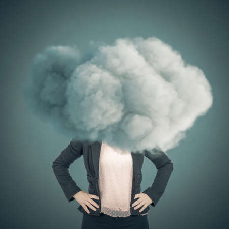 businesswoman with head in the clouds