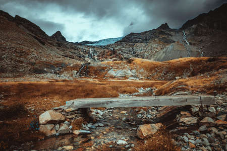 path that leads to the Fellaria glacier, points on a stream. on the Italian Alps.の写真素材