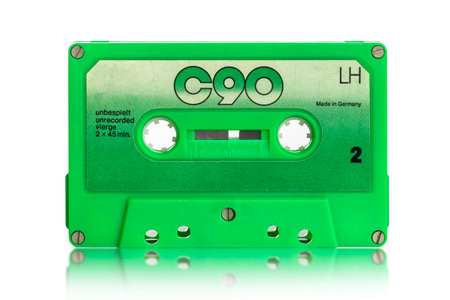 old black audio cassette on a white backgroundの写真素材
