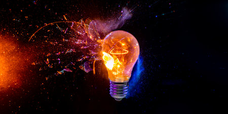 bulb breaks and creates many fragments on a black backgroundの写真素材