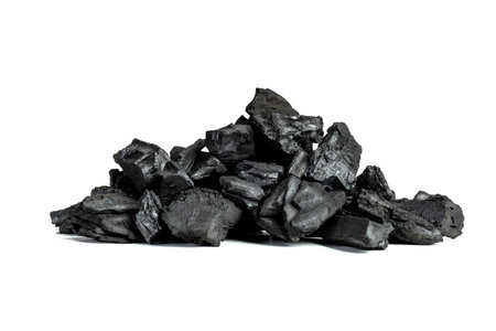 pieces of coal on a white backgroundの写真素材