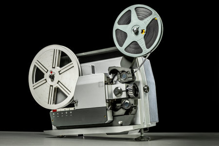 vintage super 8 projector on black backgroundの写真素材