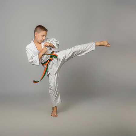 boy performs a side kick, martial artsの写真素材