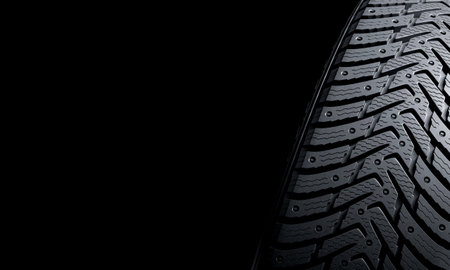 3d render winter tire detail on blackの写真素材