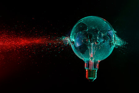 large green bulb exploding on a black backgroundの写真素材