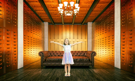 happy caucasian girl in a luxurious room with dozens of gold drawersの写真素材