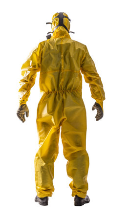 Rear view of a person dressed in a yellow hazmat suit, isolated on whiteの写真素材