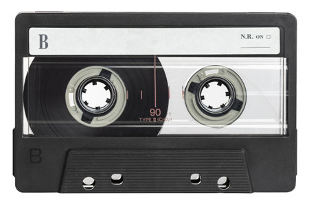Classic black audio cassette tape with a blank label, isolated on a white backgroundの写真素材