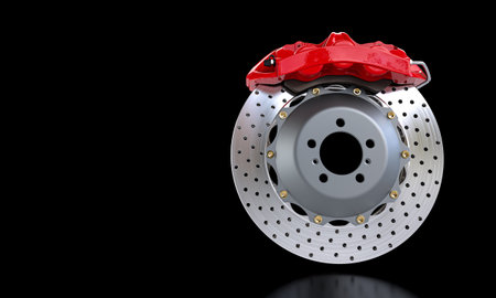 metallic car brake disc, red caliper, black background. copyspace